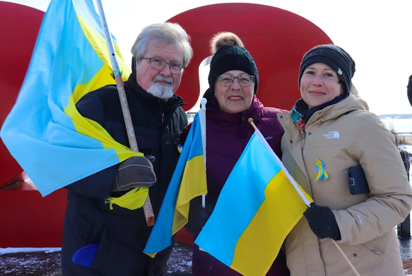 Mike Zbihlyj, Sylvia Zbihlyj and Roxanne Laughlin take part in a Feb. 25 march in Charlottetown in support of Ukraine. - Logan MacLean • The Guardian