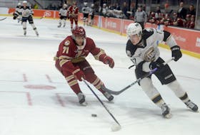 Charlottetown Islanders right-winger Lucas Romeo, right, tries to cut to the net while being defended by Acadie-Bathurst Titan blueliner Emile Perron Feb. 26 at the Eastlink Centre.
Jason Malloy • SaltWire Network