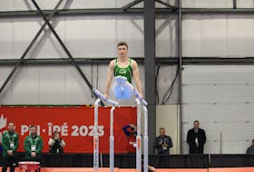 P.E.I.’s Leland Morgan performs a routine in the parallel bars’ individual final at the 2023 Canada Winter Games in Prince Edward Island on Feb. 24. The Norton Diamond Soccer Complex in Stratford hosted the artistic gymnastics events during Week 1 of competition. John McIntosh • Special to The Guardian
