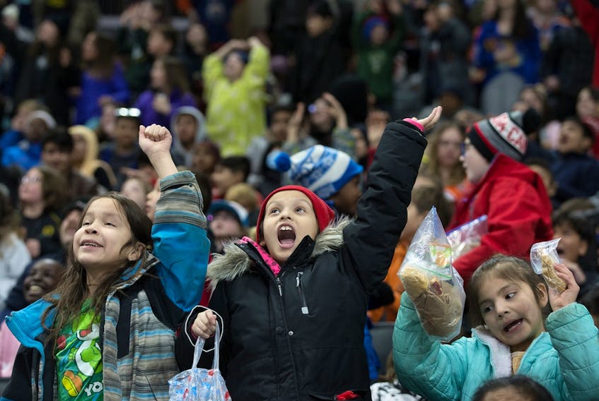 School children cheer on the Edmonton Oil Kings as they take on the Winnipeg Ice at Rogers Place in Edmonton on Tuesday, Feb. 28, 2023.