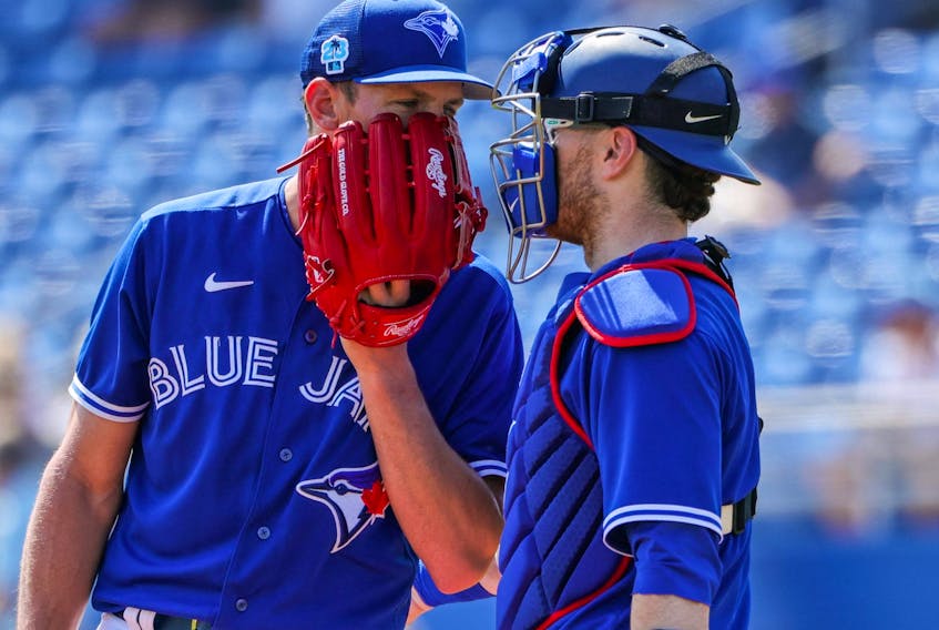 Toronto Blue Jays starting pitcher Chris Bassitt (40) and catcher Danny Jansen (9) conference at the mound during the first inning against the Detroit Tigers at TD Ballpark on Tuesday. 
