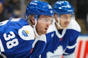 Rasmus Sandin of the Toronto Maple Leafs waits for play to resume against the San Jose Sharks during an NHL game at Scotiabank Arena on November 30, 2022 in Toronto, Ontario, Canada.  
