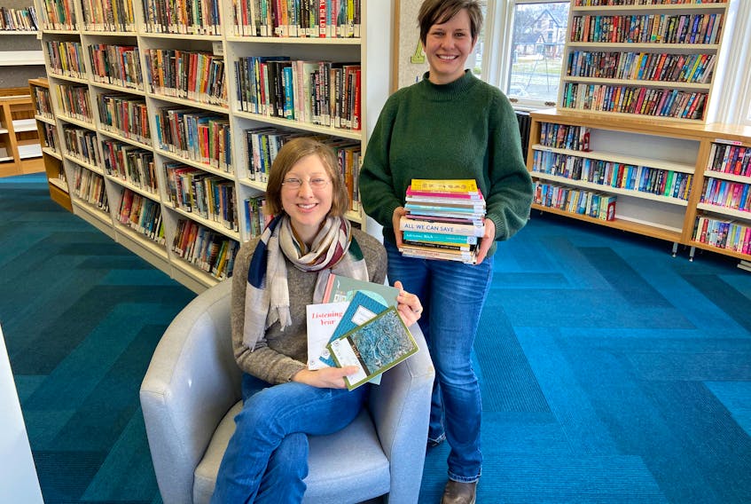 Berdene Owen, standing, and Logan Kennedy are shown at the Lunenburg Library. They are the founding members of Spot of Poetry, a poetry appreciation club for those who find joy in words and community. CONTRIBUTED