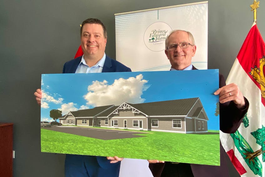 Housing Minister Matthew Mackay, left, and Kensington Mayor Rowan Caseley show designs for of the planned housing units announced for P.E.I. – Kristin Gardiner/SaltWire Network