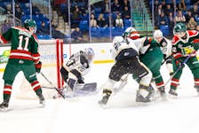 Charlottetown Islanders goaltender Jakob Robillard, 20, makes one of his 40-plus saves while Halifax Mooseheads forward Jordan Dumais, 11, attempts to get a hold of the rebound and Islanders defenceman Alexandre Tessier, 24, defends in front of his goaltender. The teams met in a Quebec Major Junior Hockey League (QMJHL) game at Eastlink Centre in Charlottetown on Feb. 2. The Islanders won the game 5-4 in a shootout. Charlottetown Islanders • Special to The Guardian