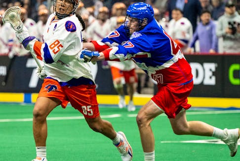 Halifax Thunderbirds' Wake:Riat (Bo) BowHunter eludes Adam Jay of the Toronto Rock during a National Lacrosse League game Jan. 14 in Hamilton, Ont. - NATIONAL LACROSSE LEAGUE
