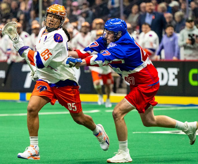 Halifax Thunderbirds' Wake:Riat (Bo) BowHunter eludes Adam Jay of the Toronto Rock during a National Lacrosse League game Jan. 14 in Hamilton, Ont. - NATIONAL LACROSSE LEAGUE