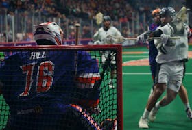 Calgary defender Jeff Cornwall beats Halifax netminder Warren Hill six seconds into overtime as the Roughnecks defeated the Thunderbirds 11-10 in National Lacrosse League play Saturday night at Scotiabank Centre. - NATIONAL LACROSSE LEAGUE
