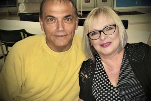 Blaine Aucoin, left, and Deborah Goudreau-Aucoin, early in their relationship in 2018 at the Royal Canadian Legion in Dominion. Aucoin introduced his then wife-to-be to darts and cars which she immediately loved. CONTRIBUTED