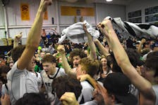 Members of the Breton Education Centre Bears celebrate after the team captured its third New Waterford Coal Bowl Classic title, defeating the Riverview Ravens 73-62 at the BEC gym in New Waterford on Saturday. JEREMY FRASER/CAPE BRETON POST
