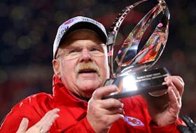 Head coach Andy Reid of the Kansas City Chiefs holds up the Lamar Hunt Trophy after defeating the Cincinnati Bengals 23-20 in the AFC Championship Game at GEHA Field at Arrowhead Stadium on January 29, 2023 in Kansas City, Missouri.