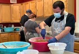 Evan Crowell (from foreground), Ariana Nickerson and Dylan VanBuskirk are busy in the kitchen at Mayflower Place in Barrington Passage. Operated by the Shelburne Area Supporting Inclusion (SASI) Mayflower Place is one of three sheltered workshops in Shelburne County supported by SASI. KATHY JOHNSON