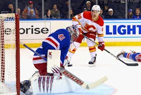 New York Rangers goaltender Jaroslav Halak makes a save on Calgary Flames forward Andrew Mangiapane at Madison Square Garden in New York on Monday, Feb. 6, 2023.