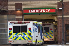 An ambulance waits outside the University of Alberta Hospital emergency area on Jan. 24, 2022.