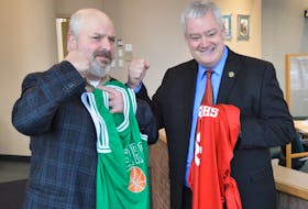 Cape Breton Regional Municipality councillors Darren O’Quinn, left, and Steve Gillespie put up friendly fighting words before last week's council meeting at city hall on who would win this year’s Coal Bowl Classic in New Waterford: the Breton Education Centre Bears (in O’Quinn’s district) or the Coxheath-based Riverview Ravens (in Gillespie’s district). According to Gillespie, the losing team would wind up donating $100 to a charity of the winning team’s choice. Following the Bears' 73-62 tournament championship victory over the Ravens, O'Quinn said Monday the win would just be for bragging rights, and both he and Gillespie intended to donate $100 each to Special Olympics basketball during an event Thursday, 6-7 p.m., at Brookland Elementary School in Sydney. IAN NATHANSON/CAPE BRETON POST