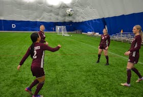 Members of the Holland Hurricanes kick around the ball at the Credit Union Place Dome on Feb. 7 following a media conference announcing the 2023 Canadian Collegiate Athletic Association (CCAA) will take place at Eric Johnston Field in Summerside from Nov. 8 to 11. The players are Kina Azuna, 2; Keanna Ryan, 16; Hayden Chaisson, 6, and Emily Lepine. Jason Simmonds • The Guardian