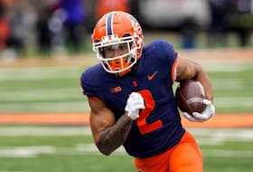 Illinois running back Chase Brown carries the ball during the first half of an NCAA college football game against Purdue Saturday, Nov. 12, 2022, in Champaign, Ill.