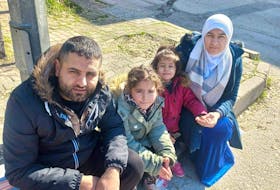 From left to right, Wile, Hiba, Hala and Noor, sit on the curb after being displaced from their home in Gaziantep, Turkey, following a 7.8-magnitude earthquake on Feb. 6, 2023.
