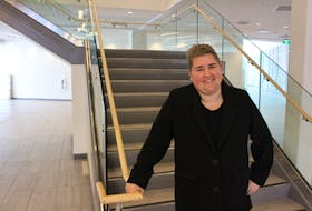 Laura O’Laney, interim director of ancillary services at UPEI stands by the staircase in the lobby of the university’s new residence building, and athlete’s village for the Canada Games. George Melitides • The Guardian