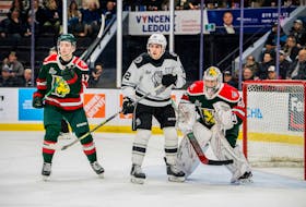 Halifax Mooseheads defenceman Cam Whynot and goalie Mathis Rousseau protect the net against Gatineau Olympiques forward Olivier Nadeau during Wednesday's QMJHL game in Gatineau. - Dominic Charette/Gatineau Olympiques
