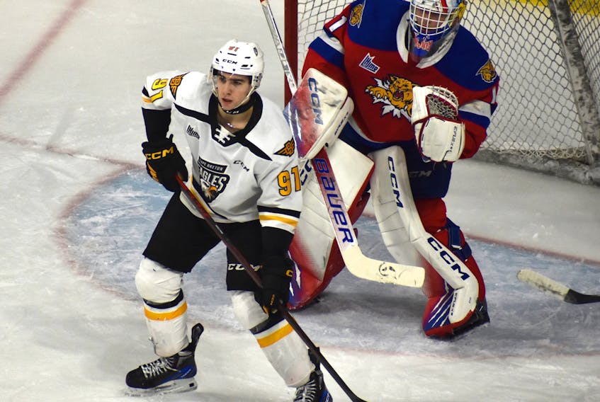 Cape Breton Eagles forward Jacob Newcombe, left, stands in front of Moncton Wildcats goaltender Jacob Steinman during Quebec Major Junior Hockey League action at Centre 200 in Sydney earlier this season. The 18-year-old has seven goals and 17 points in 24 games with the Eagles since the start of the second half of the season. JEREMY FRASER/CAPE BRETON POST