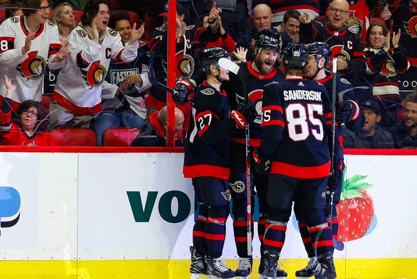 Ottawa Senators left wing Austin Watson (16) celebrates with teammates after scoring a short-handed goal against the Detroit Red Wings during the first period at the Canadian Tire Centre on Tuesday, Feb. 28, 2023. 