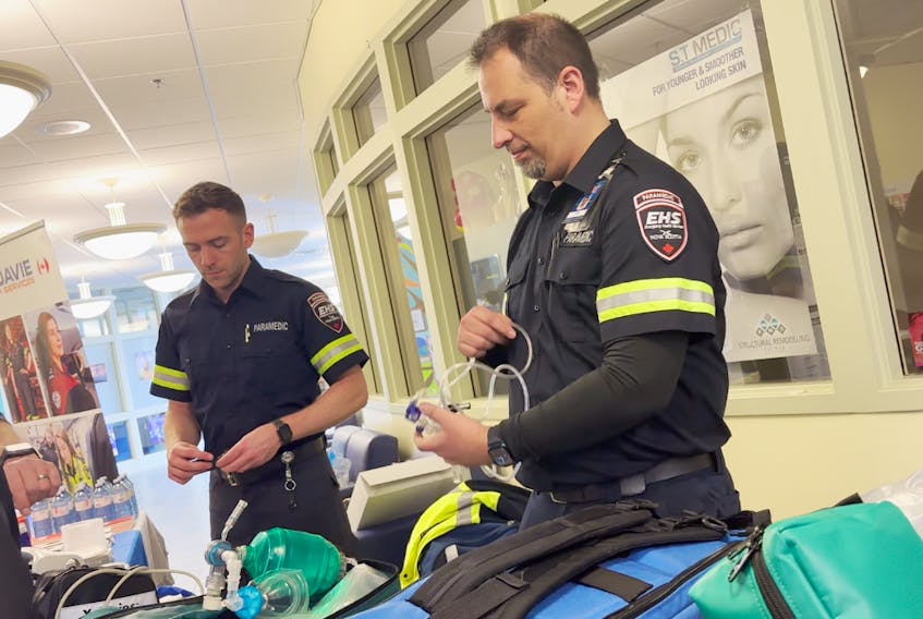 Paramedics Jordan Stevenson and Doug Allen were on hand at an EHS/Medavie Health Services open house held recently at NSCC Burridge Campus in Yarmouth to answer questions about upcoming Primary Care Paramedic Program that will be offered here starting in May. TINA COMEAU PHOTO