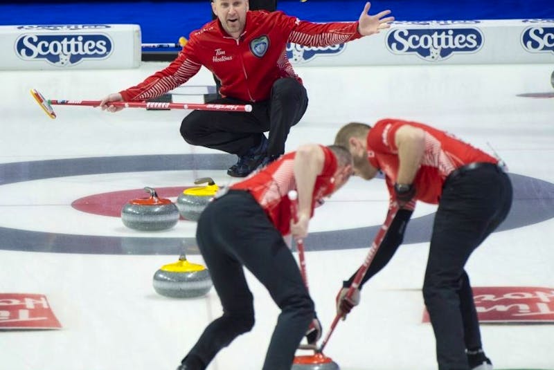 Team Canada skip Brad Gushue (top), lead Geoff Walker and second E.J. Harnden against Team Wild Card 3.  Curling Canada /Michael Burns Photo