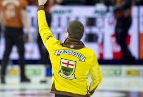 Manitoba's Matt Dunstone celebrates after booking a spot in the Tim Hortons Brier final on Sunday with a 7-5 win over Brendan Bottcher. 