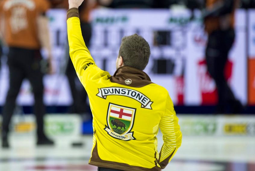 Manitoba's Matt Dunstone celebrates after booking a spot in the Tim Hortons Brier final on Sunday with a 7-5 win over Brendan Bottcher. 
