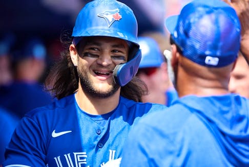 Blue Jays' Bo Bichette smiles after hitting a home run against the Boston Red Sox during the fourth inning at TD Ballpark on Monday, March 13, 2023. 