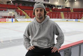 Tanner Humber-Dredge on the bench at the Community Credit Union Arena.