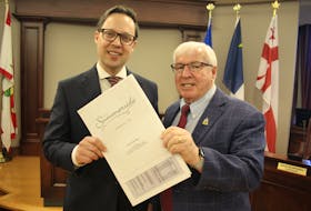 Summerside Mayor Dan Kutcher, left, and Coun. Bruce MacDougall, on behalf of council, presented the draft version of the city’s 2023/2024 budget on March 13. Colin MacLean