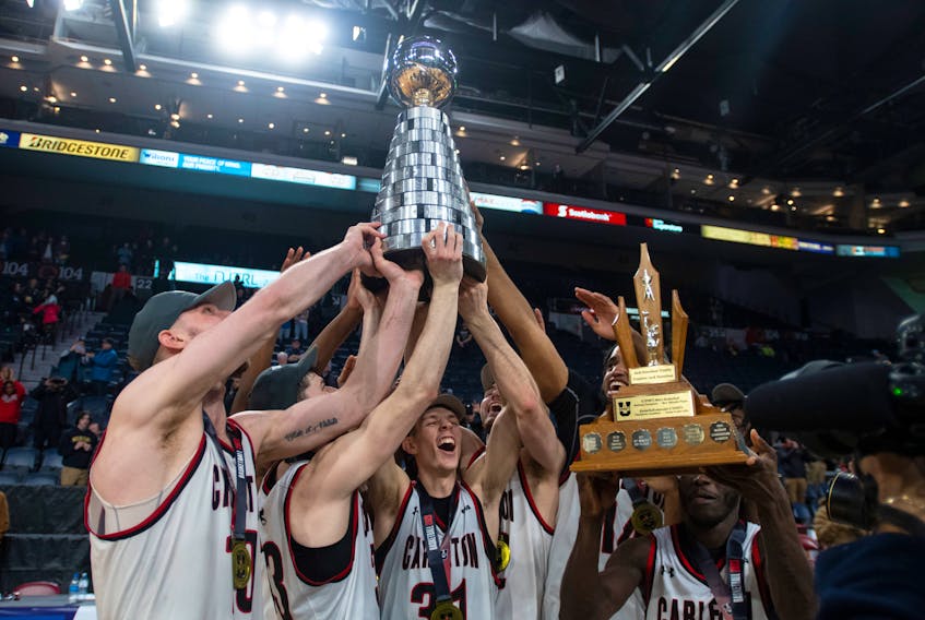 Carleton Ravens players celebrate their 109-104 double overtime game over the St. Francis Xavier X-Men in the U Sports Final 8 championship game on Sunday, March 12, 2023. 
Ryan Taplin - The Chronicle Herald