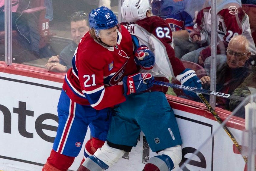 Montreal Canadiens defenceman Kaiden Guhle checks Colorado Avalanche left-wing Artturi Lehkonen during first period at the Bell Centre in Montreal on March 13, 2023.