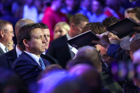 Florida Gov. Ron DeSantis signs copies of his book after speaking to Iowa voters during an event at the Iowa State Fairgrounds on March 10, 2023 in Des Moines, Iowa. DeSantis, who is widely expected to seek the 2024 Republican nomination for president, is one of several Republican leaders visiting the state this month.   (Photo by Scott Olson/Getty Images)