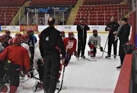Head coach Greg Mullen (right) goes over a drill for his Truro Major U-15 Bearcats who are hosting the provincials from March 16 to 19 at the Rath Eastlink Community Centre.