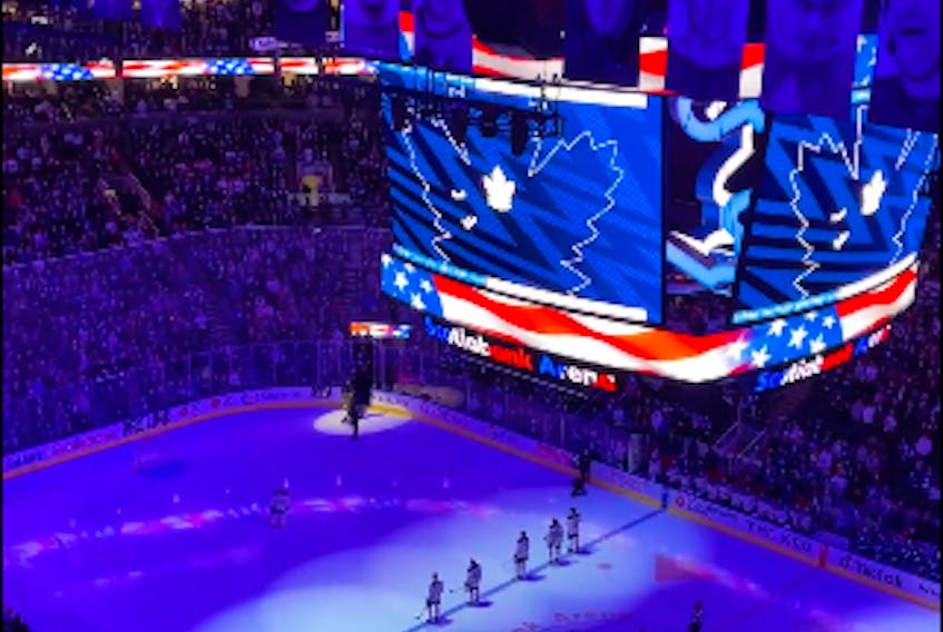 Maple Leafs fans sing the U.S. anthem after a mic malfunction ahead of the tilt against the Buffalo Sabres at Scotiabank Arena in Toronto on March 13, 2023.
