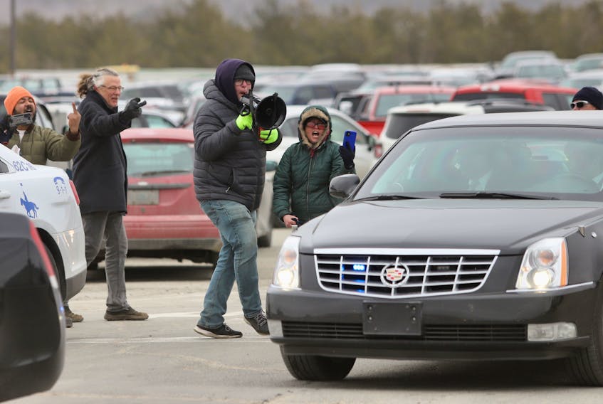 Demonstrators her abuse at the motorcade of Prime Minister, Justin Trudeau as they leave the Michelin plant in Bridgewater Nova Scotia, March 14, 2023.

TIM KROCHAK PHOTO