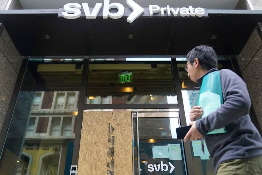 A pedestrian passes a Silicon Valley Bank Private branch in San Francisco.