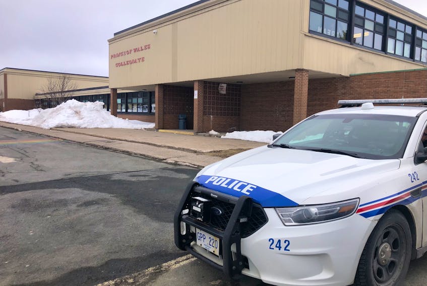 A police car is seen outside of Prince of Wales Collegiate on Wednesday, March 15. A fourth teen was has now been arrested and charged with attempted murder in relation to an attack of a student outside the school on March 9.  - Joe Gibbons/The Telegram