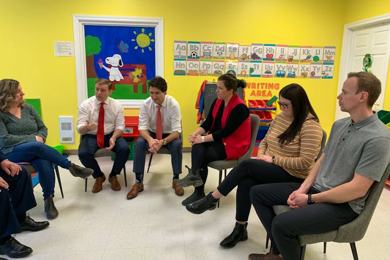 Premier Andrew Furey, second from left, and Prime Minister Justin Trudeau talk to parents at Discovery Daycare in Shoal Harbour May 15 during a childcare funding announcement. The parents - Patti Barrett, Jenna Hillier, Victoria Morrissey and Marcus Morrissey - shared some of the challenges they're facing. - Barb Dean-Simmons/SaltWire