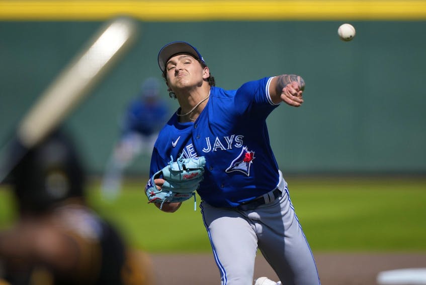 Blue Jays pitcher Ricky Tiedemann throws in the fifth inning of a spring training game against the Pittsburgh Pirates in Bradenton, Fla., Tuesday, March 7, 2023. 