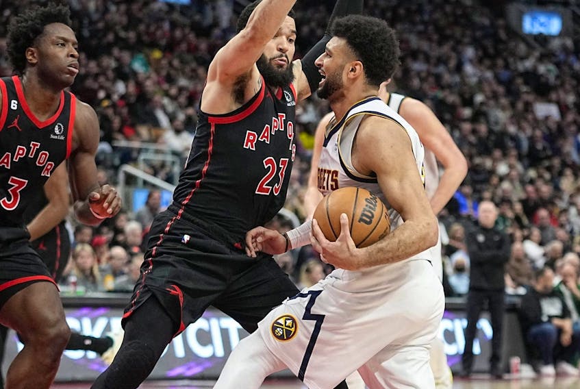 Toronto Raptors forward O.G. Anunoby (3) and guard Fred VanVleet (23) defend against Denver Nuggets guard Jamal Murray (27) during the second half at Scotiabank Arena. 