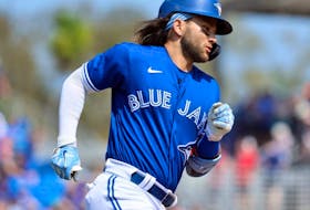Blue Jays shortstop Bo Bichette hits a home run against the Red Sox during fourth inning spring training action at TD Ballpark in Dunedin, Fla., Monday, March 13, 2023.