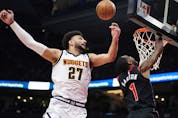  Denver Nuggets’ Jamal Murray knocks the ball away from Raptors’ Will Barton during the first half in Toronto on Tuesday, March 14, 2023.