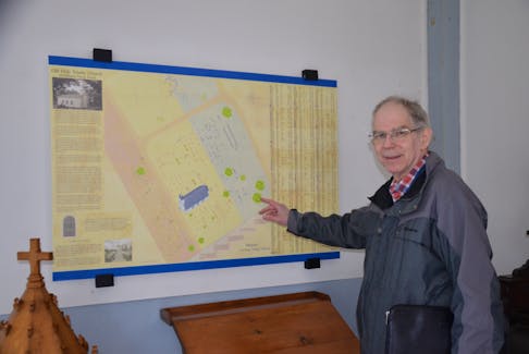 Brian McConnell points to a representation of Old Holy Trinity Church and cemetery in Middleton where there are numerous unmarked Black Loyalist graves.       
Lawrence Powell