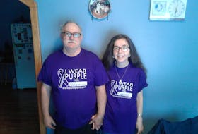 Christina Keough and her husband Eugene of Plate Cove East, N.L. wear their purple shirts to raise awareness about epilepsy. Contributed photo