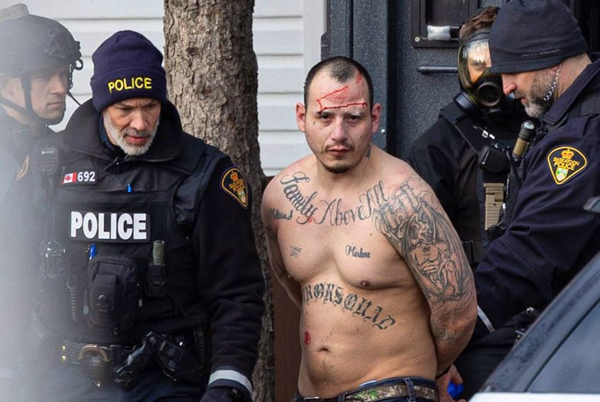 Michelle Berg's photo of the arrest of William Jack Henderson is nominated in the breaking news category.