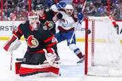 Mads Sogaard of the Senators tracks the puck after making a first-period save against the Avalanche on Thursday night.